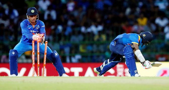 Sri Lanka's Akila Dananjaya is stumped out by India's MS Dhoni