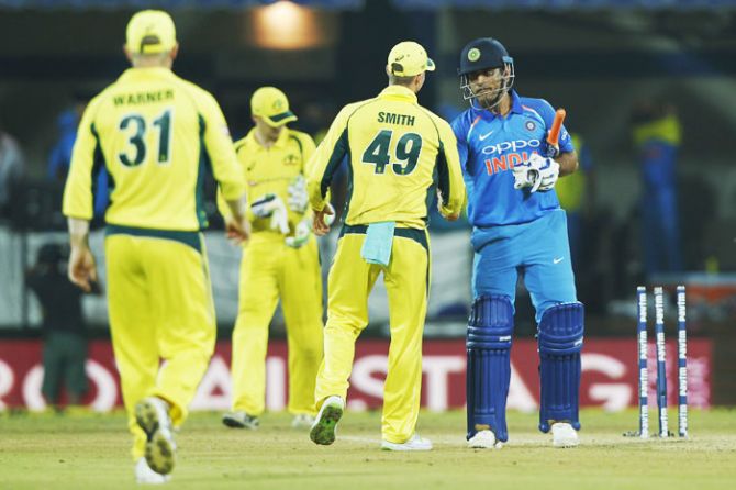 Australia captain Steve Smith congratulates India's Mahendra Singh Dhoni after their victory in the 3rd ODI in Indore on Sunday