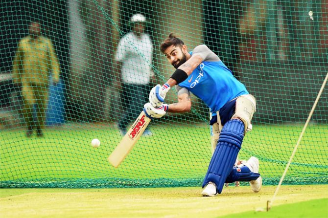Skipper Virat Kohli bats in the nets during a practice session at Chinnaswamy Stadium in Bengaluru on WednesdaY, on the eve of the 4th One Day International cricket match against Australia
