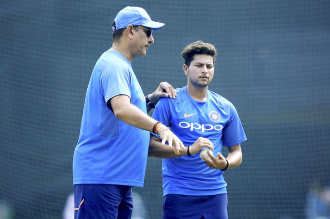 Coach Ravi Shastri gives instructions to Kuldeep Yadav in the nets