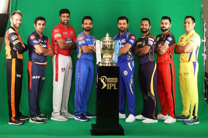 Captains of the IPL franchises pose with the IPL Trophy on Friday