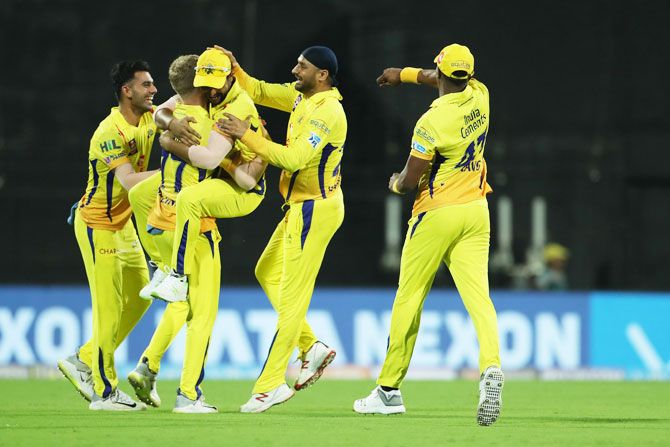 Chennai Super Kings players celebrate a wicket