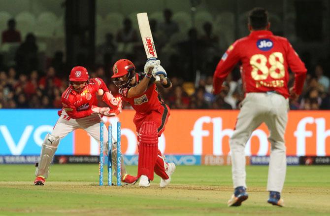 RCB's Virat Kohli is clean bowled by Kings XI Punjab's Mujeeb Ur Rahman