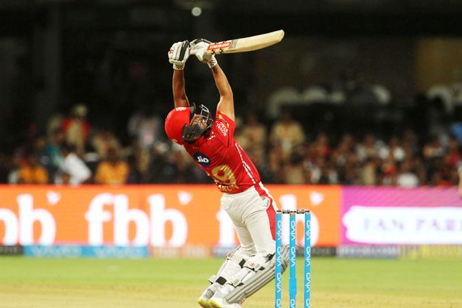 Karun Nair plays a lofted shot over the keeper's head for a boundary