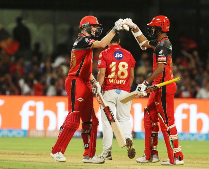 Royal Challengers Bangalore's Chris Woakes and Washington Sundar celebrate after the latter hit the winning runs