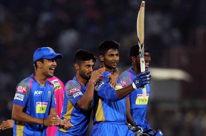 Krishnappa Gowtham, centre, celebrates with his team mates after guiding Rajasthan Royals to victory.