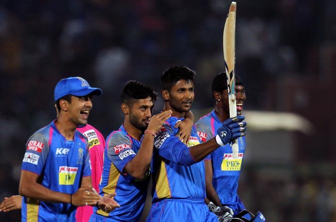 Krishnappa Gowtham, centre, celebrates with his team mates after guiding Rajasthan Royals to victory.