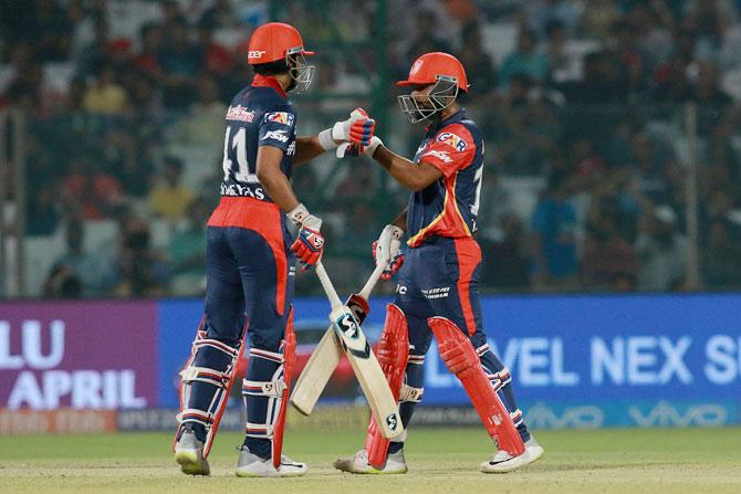 Rahul Tewatia and Shreyas Iyer celebrate their 50-run partnership