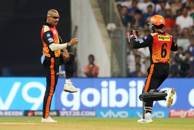 Sunrisers Hyderabad's Shikhar Dhawan celebrates the wicket of Mumbai Indians captain Rohit Sharma