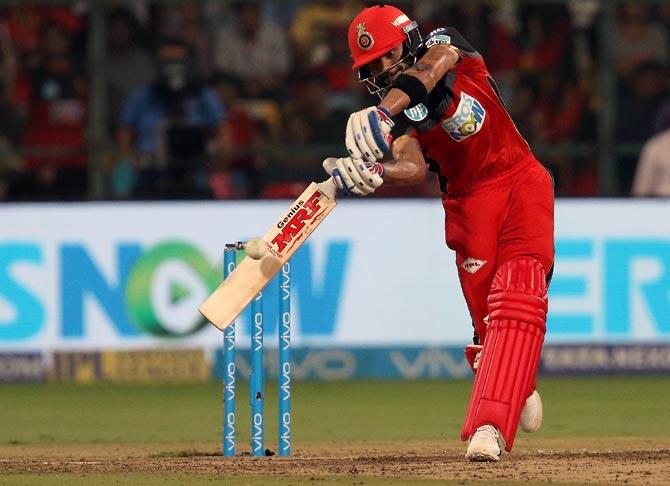 Virat Kohli hits a boundary in the game against KKR, April 30,. 2018. Photograph: BCCI