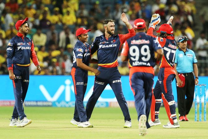 Delhi Daredevils players celebrates the wicket of Chennai Super Kings' Suresh Raina 