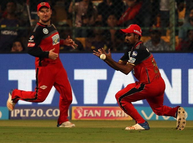 Murugan Ashwin, right, drops Chris Lynn off Yuzvendra Chahal's bowling