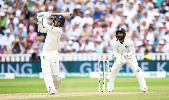 England's Sam Curran hits a six to get to his half-century