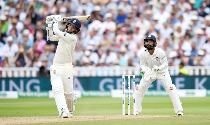 Sam Curran hits out for six runs watched India wicketkeeper Dinesh Karthik on Friday