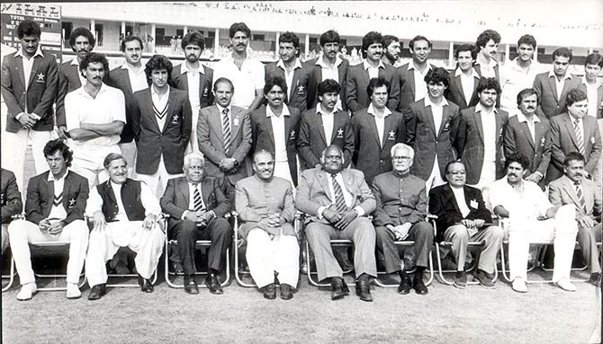 Imran Khan, left, with then Pakistan's military dictator General Zia-ul Haq, fourth from left, Indian and Pakistan cricketers, and cricket board officials from both nations at the Jaipur Test in 1987