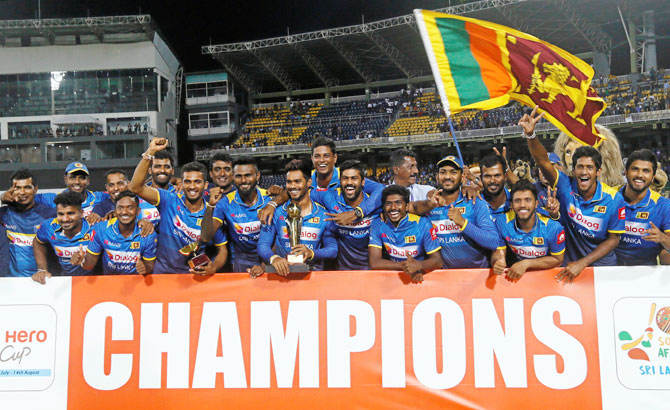 Sri Lanka players pose for photographs with the trophy after beating South Africa to win the one-off T20 in Colombo on Tuesday