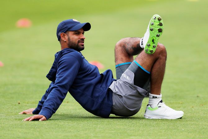 India's Shikhar Dhawan takes a break during a nets session