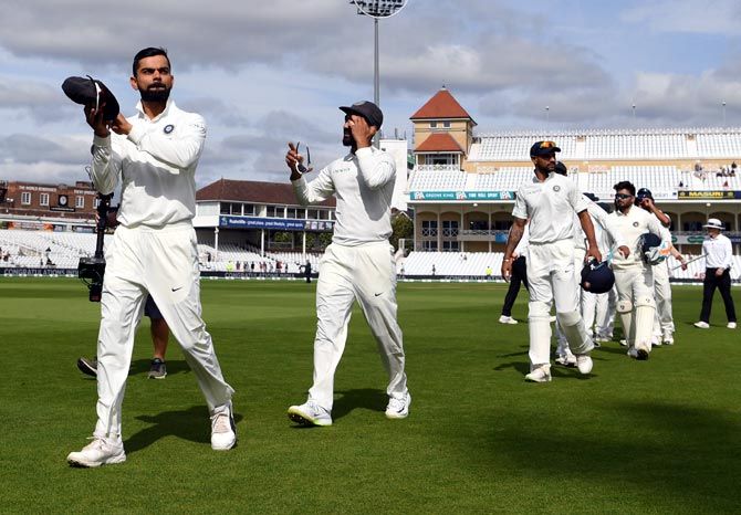 Virat Kohli leads his team off the field after winning the third Test in Nottingham. Photograph: Gareth Copley/Getty Images