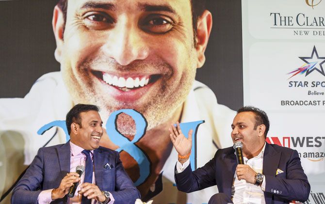 VVS Laxman and Virendra Sehwag chat during the book launch on Tuesday