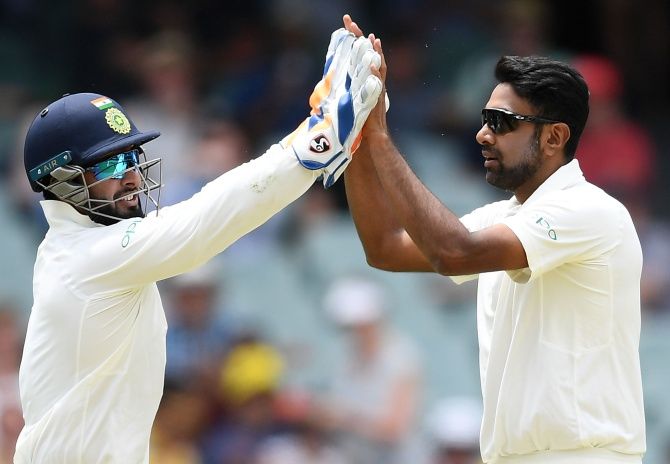 Ravichandran Ashwin and Rishabh Pant celebrate Marcus Harris's wicket