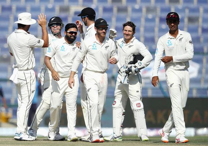 New Zealand players celebrate after beating Pakistan on Day 5 of the 3rd Test in Abu Dhabi on Friday