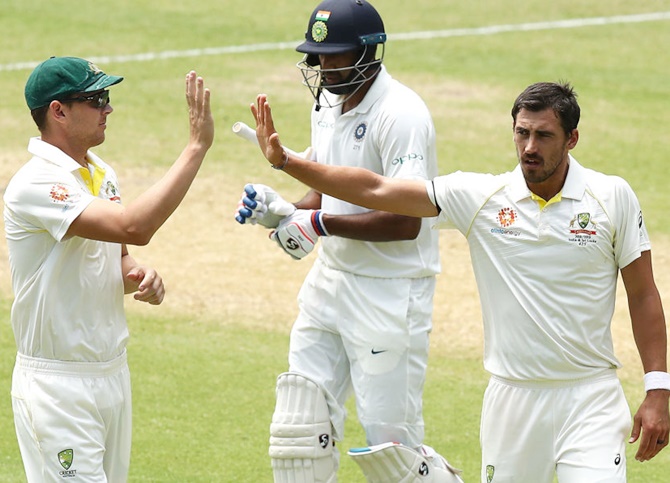  Mitchell Starc of Australia celebrates after taking the wicket of Ravichandran Ashwin in the Adelaide Test. Starc picked only five wickets in the opening Test against India