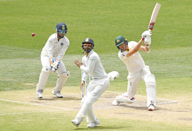 Pat Cummins lead Australia's lower order rear guard, making a 121-ball 28