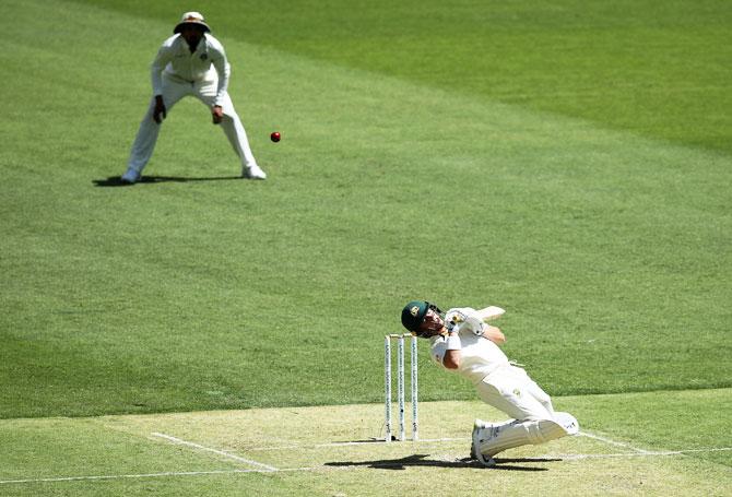 Marcus Harris takes evasive action against a short ball