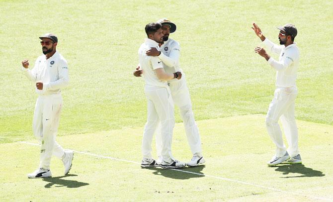 Umesh Yadav celebrates dismissing Usman Khawaja