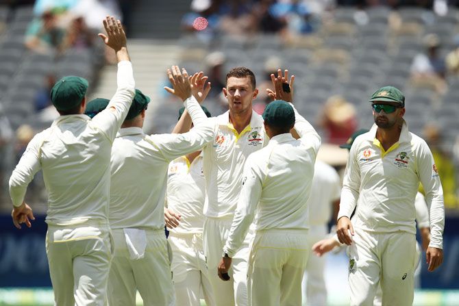 Australia's Josh Hazlewood celebrates after taking the wicket of India's Hanuma Vihari