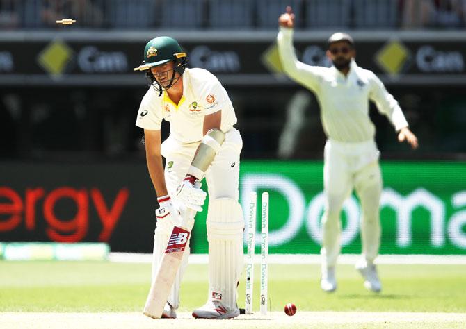 Pat Cummins is bowled by Jasprit Bumrah