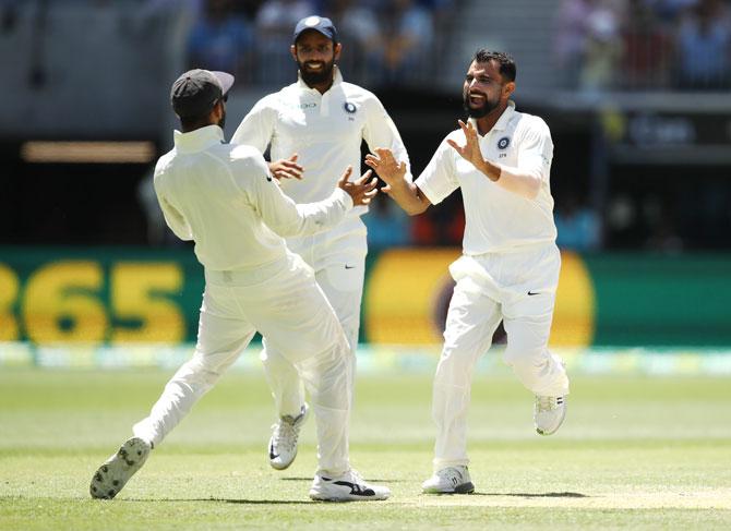 Mohammed Shami celebrates dismissing Usman Khawaja