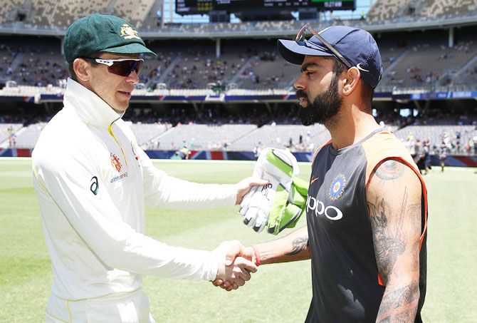 Australia captain Tim Paine is congratulatd by Virat Kohli after the match