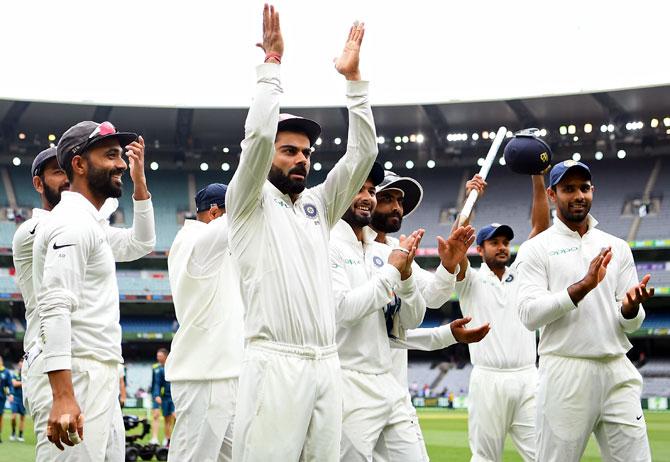 India's players celebrate winning the third Test against Australia at MCG on December 30, 2018 