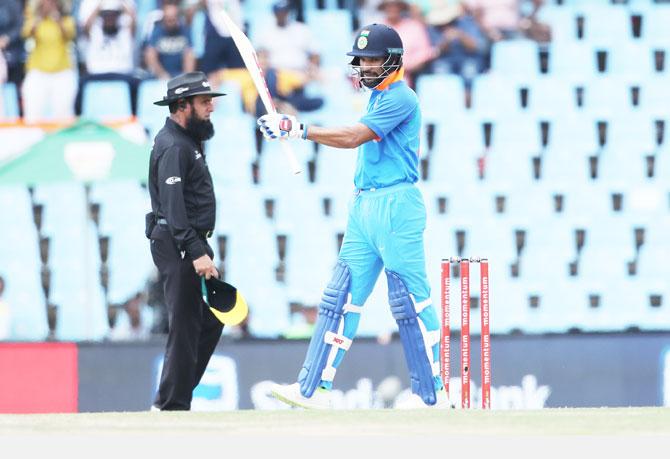 India opener Shikhar Dhawan acknowledges the crowd on completing his half-century