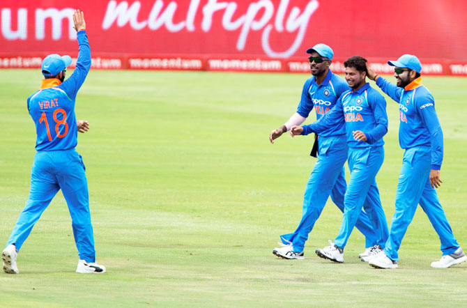 Kuldeep Yadav is congratulated by teammates after taking the wicket of Aiden Markram on Sunday