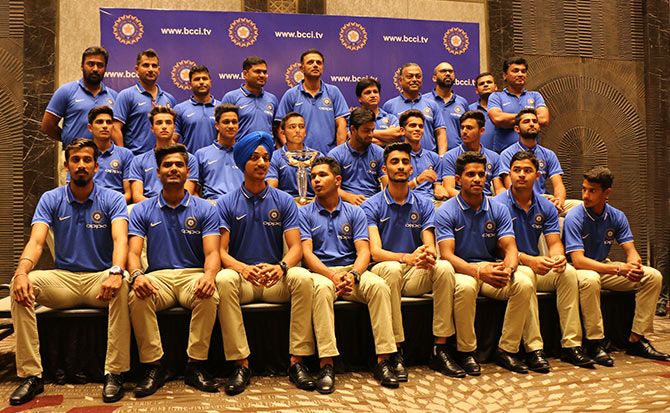 The victorious India Under-19 team and the support staff pose with the World Cup for a photo-op in Mumbai. Photograph: Satish Bodas/Rediff.com