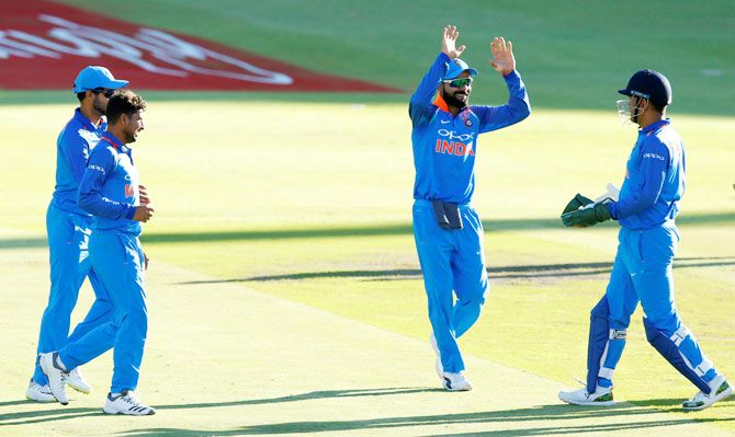 India's Virat Kohli celebrates with wicket-keeper Mahendra Singh Dhoni after the dismissal of South Africa's Aiden Markram