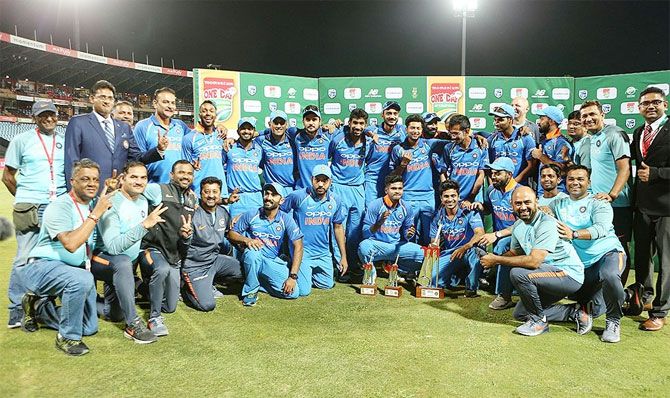 The Indian team and support staff with the trophy after winning the series 5-1 on Friday