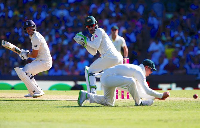 England's Dawid Malan watches as Australia's captain Steve Smith drops a catch
