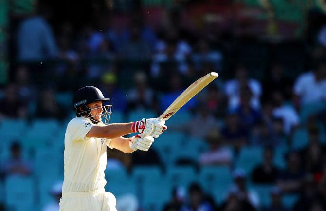 England's Joe Root bats en route his 83