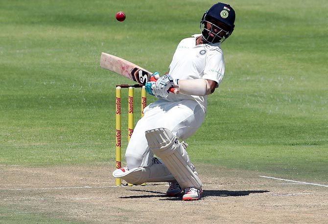 Cheteshwar Pujara avoids a bouncer during play on Day 3  of the first Test