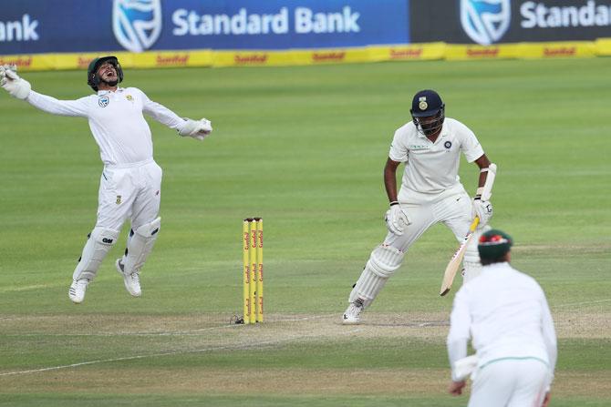 South Africa's Quinton de Kock takes the catch to dismiss India's Ravichandran Ashwin and effectively end India's fight on Day 4 of the first Test at the Newlands Cricket Ground in Cape Town on Monday