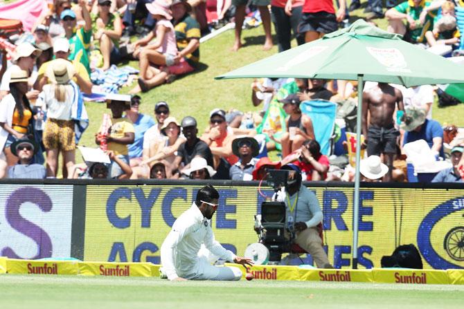 India'S KL Rahul slides as he fields on the boundary 