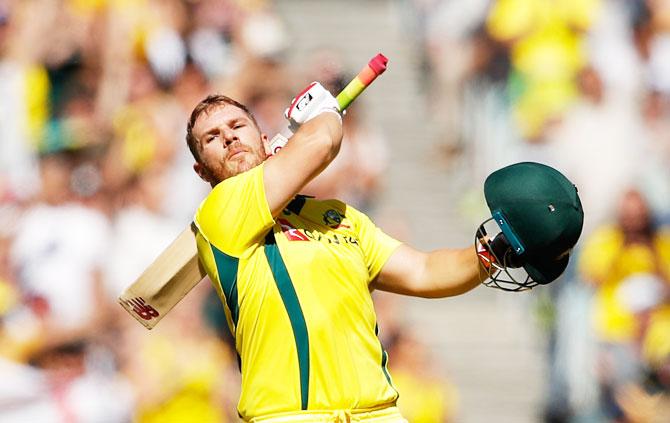 Finch celebrates on scoring his century. He made 107.