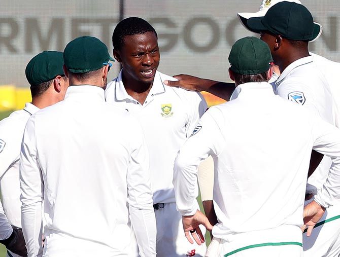 South Africa pacer Kagiso Rabada celebrates with teammates after taking the wicket of India opener Murali Vijay on Tuesday