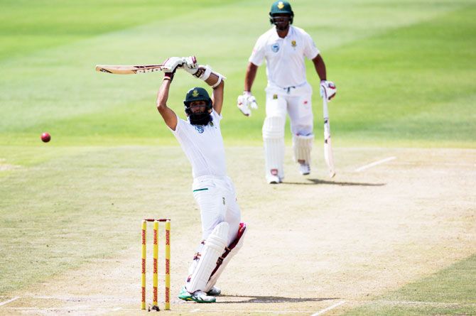 South Africa's Hashim Amla evades a delivery