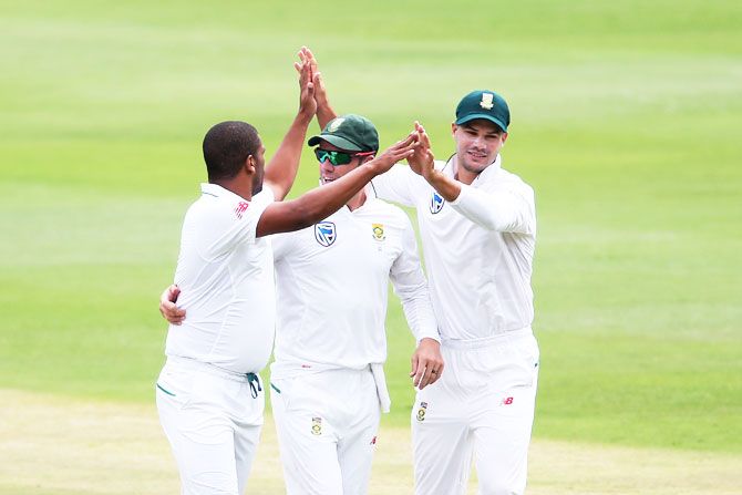 South Africa's Vernon Philander is congratulated by AB de Villiers and Aiden Markram after dismissing Lokesh Rahul