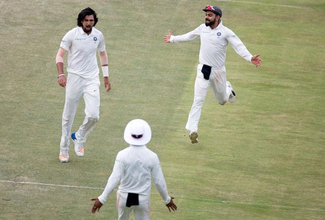 India's Ishant Sharma and Virat Kohli celebrate on dismissing South Africa’s Faf Du Plessis