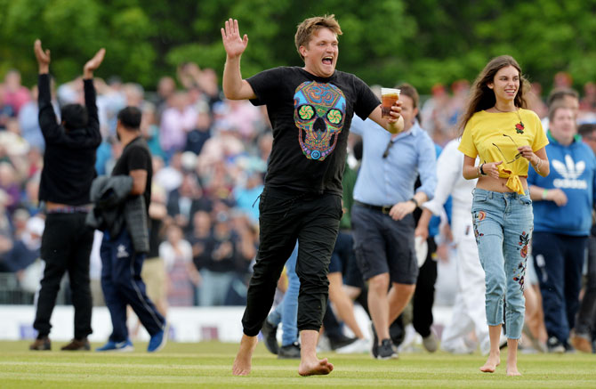 Scotland fans invade the field after their team's shock 6-run win over England